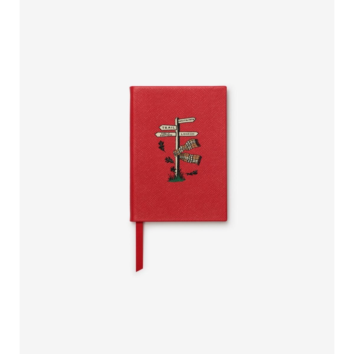 Caderno vermelho com desenho de placa de estrada e referência ao xadrez Burberry.