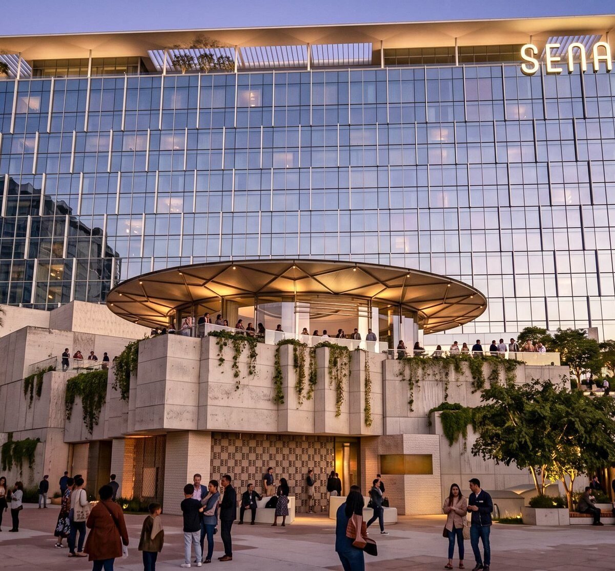 Renderização do hotel SENA no complexo OCVIBE, em Anaheim, com fachada de vidro e terraço circular iluminado ao entardecer