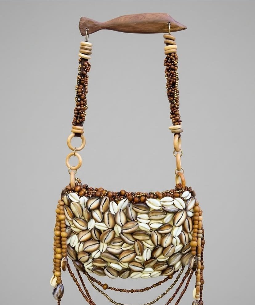 Trancosina Zuri handbag with cowrie shells, wooden beads and a carved handle