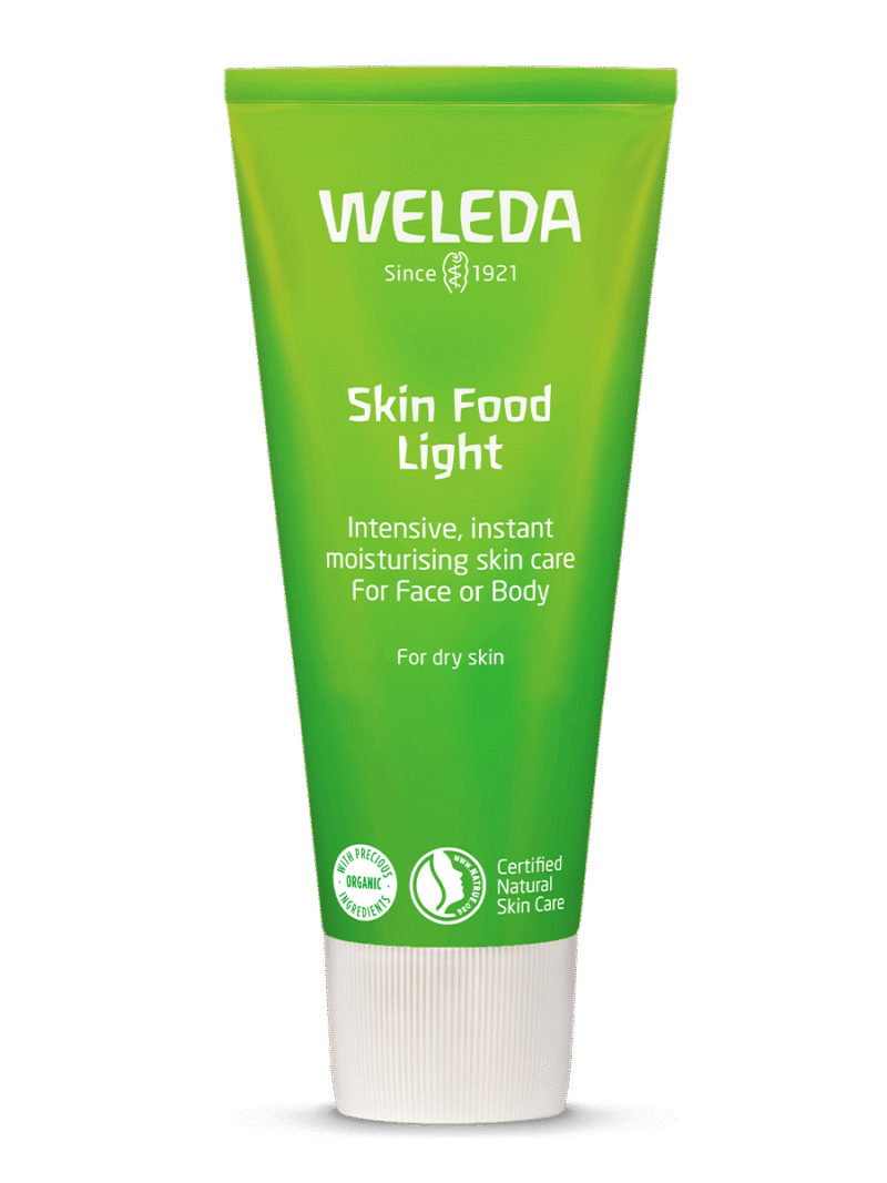 Bisnaga verde do creme Weleda Skin Food Light sobre fundo branco